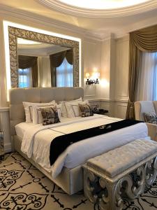 a large bedroom with a large bed with a large mirror at Capitol Park By Sahara Hotel in Jakarta