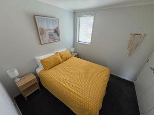 Ένα ή περισσότερα κρεβάτια σε δωμάτιο στο Cozy Crescent