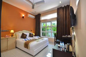 Una habitación en Gunbaru Inn