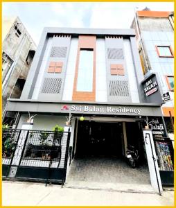 a building with a doorway with a sign that reads boston residency at Hotel S B Residency Near Shri Sai Baba Temple - Fully Air conditioned Room - Free Wifi And parking Available - Best Premium Hotel In Shirdi in Shirdi