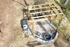 an overhead view of a grill with chairs on it at Alone At Last - New LUX - WiFi - Hot Tub in High Falls