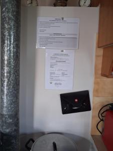 a wall with a piece of paper on it at πλατανα Αστρους Αρκαδίας χωριατικο σπίτι για φυση και ηρεμία in Rounaíika