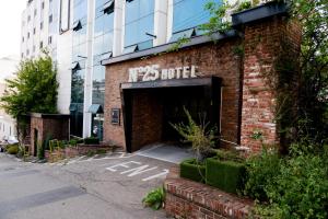 a brick building with a sign that reads ny motel at hotel No25 in Incheon