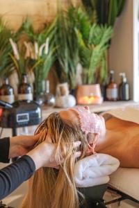 a woman getting a back massage in a salon at Taigh Scalpaigh in Portree
