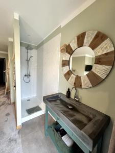 a bathroom with a sink and a mirror at Côté Nuit in Capestang +69 photos