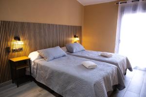 Llit o llits en una habitació de Ca La Padrina