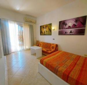 Postel nebo postele na pokoji v ubytování La Sirena Resort