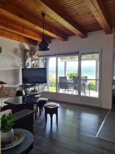 a living room with a view of the ocean at Vienna Rem in Lukavac