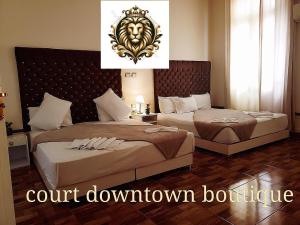 Ένα ή περισσότερα κρεβάτια σε δωμάτιο στο Qasr court