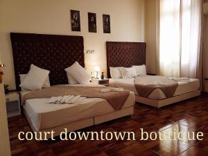 Ένα ή περισσότερα κρεβάτια σε δωμάτιο στο Qasr court