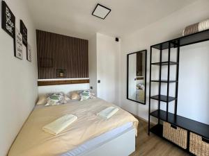 a bedroom with a large bed in a room at Apartments Hajl in Krk