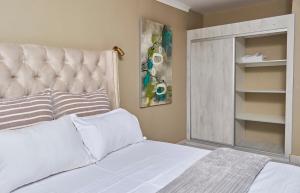 Ένα ή περισσότερα κρεβάτια σε δωμάτιο στο Mawi Homes +15 φωτογραφίες