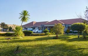 Κήπος έξω από το Mawi Homes