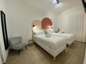 Postel nebo postele na pokoji v ubytování Palazzo Diana Apartment