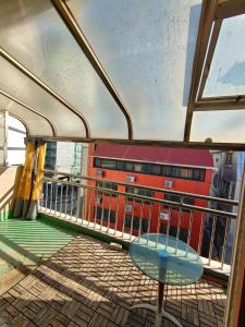 a balcony on a cruise ship with a table at A total of 4 people on one floor of a building close to Incheon Airport that can be used for a short period of time in Seoul +16 photos