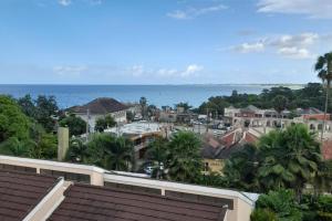 a view of a city with the ocean in the background at Seaview Paradise - Sleeps 3 - Pool - Parking in Negril