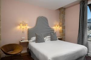 Ένα ή περισσότερα κρεβάτια σε δωμάτιο στο Hotel Carmen Boutique +54 φωτογραφίες