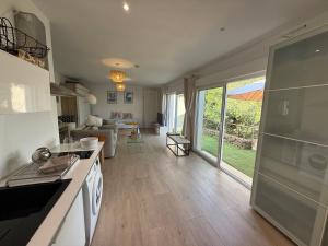 a kitchen and living room with a view of a living room at Villa Pietranera in San-Martino-di-Lota