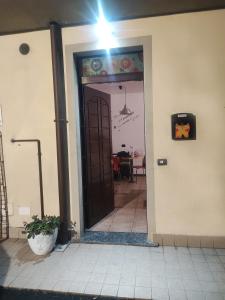 an open door to a room with a table at Leo House in Trezzo sullʼAdda