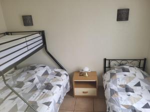 Ένα ή περισσότερα κρεβάτια σε δωμάτιο στο Maison individuelle pour vacances ou travail à 3 min du pal, 5 min Dompierre sur besbre, 20 min de moulins,tout confort, prêt à vous accueillir