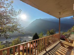 a balcony with a view of the mountains at Samora Retreats, Manali in Vashisht