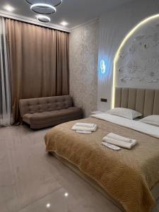 En eller flere senge i et værelse på Lion Vip Hotel