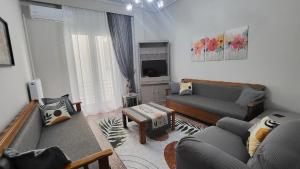 TV a/nebo společenská místnost v ubytování MG Boho Apartment