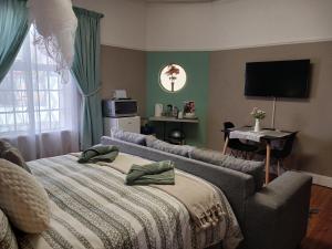 Postel nebo postele na pokoji v ubytování Karoo Rust Victoria West