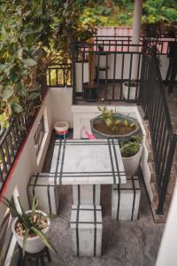 a balcony with a table and potted plants at ROYAL CREST VILLA in Weligama +47 photos