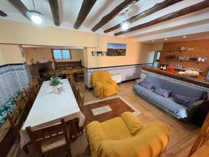 a living room with a table and a couch at Hostal San José in Naval