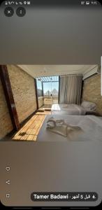 a picture of a bedroom with a bed and a window at Hany pyramids view in Cairo