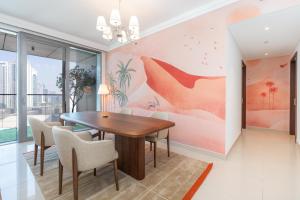 a dining room with a table and chairs at Boulevard Point I Burj Khalifa Fireworks View in Dubai