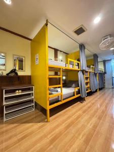 a room with bunk beds in a dorm room at Easy Hostel in Phi Phi Don