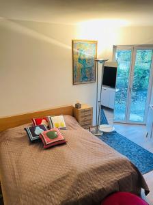 a bedroom with a bed with books and a television at Your exclusive holiday home in Winterthur