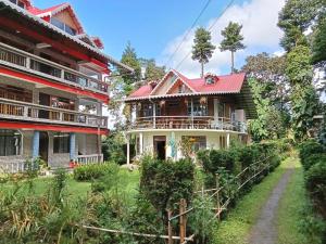 a house with a red roof at Bloomfield Farmhouse 2 in Darjeeling