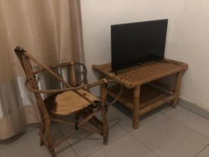 TV a/nebo společenská místnost v ubytování The Secret Inn Guest House Nyamata + 10 fotografií