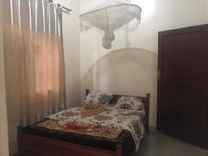 Postel nebo postele na pokoji v ubytování The Secret Inn Guest House Nyamata