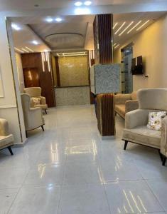 a waiting room with couches and chairs in a building at Pyramids star of Khafre in Cairo