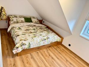 a bedroom with a bed in a attic at Apartment K&L Boží Dar in Boží Dar