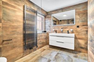 a bathroom with a sink and a mirror at Apartment K&L Boží Dar in Boží Dar +21 photos