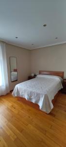 Postel nebo postele na pokoji v ubytování Casa Rural Busto + 6 fotografií