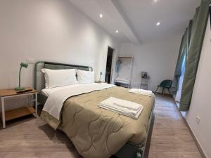 Postel nebo postele na pokoji v ubytování Albano Film Home - Castelli Apartments