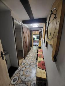 a hallway of a bathroom with a floor with a tile floor at U Efy in Josefuv dul