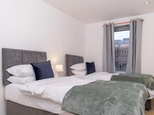 Voodi või voodid majutusasutuse The Sycamore Suite toas