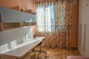 a bathroom with a desk and a window at Casa della Fortuna in San Miniato +41 photos
