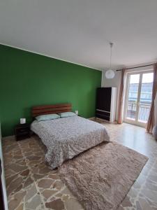 Postel nebo postele na pokoji v ubytování La casa di Nerone