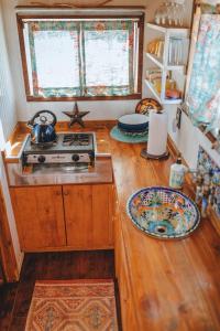 a kitchen with a stove and a counter top at Unique Glamping Getaway on a Dude Ranch near Las Vegas, Nevada in Sandy Valley