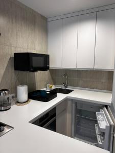 Η κουζίνα ή μικρή κουζίνα στο Апартаменти ЖК "Сонячний Квартал"