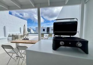 a toaster sitting on a counter in a living room at casamujeres in Punta Mujeres