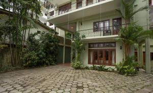 a building with a courtyard in front of it at Amanda Hills in Kandy